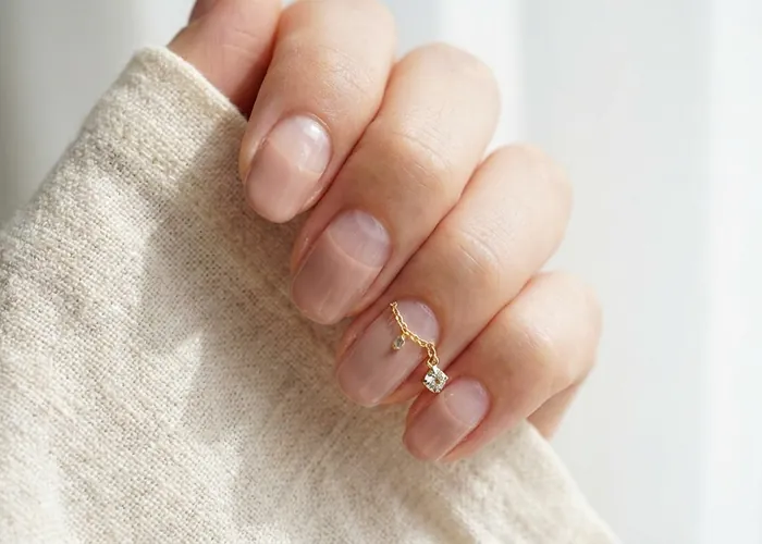Negative Space Nails With Charms: The Minimalist Trend With A Twist